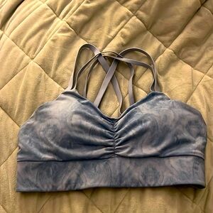 Like new! “Handful” sports bra w/ criss cross straps, wide band, removable pads.